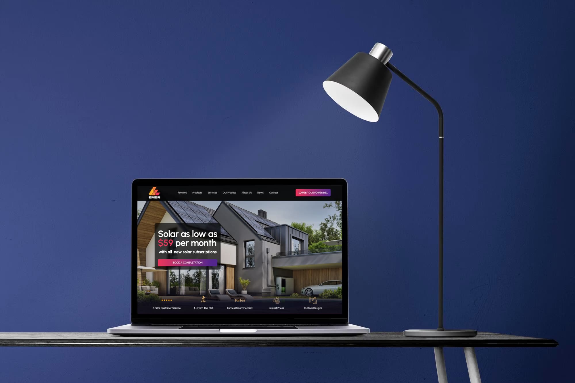 EMBR Solar website shown on a laptop